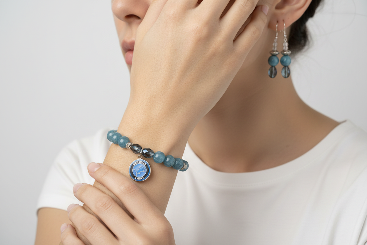 Lifestyle photo of Detroit Lions Aurora Czech Glass & Apatite Set showing bracelet and earrings being worn together